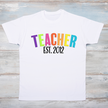 Load image into Gallery viewer, TEACHER with Established Date, multi color letters T-Shirt